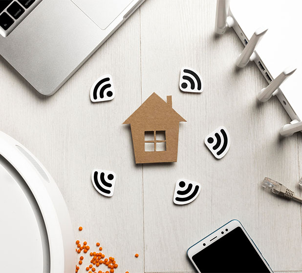 footer_0004_top-view-wi-fi-router-with-house-figurine-wireless-controlled-devices